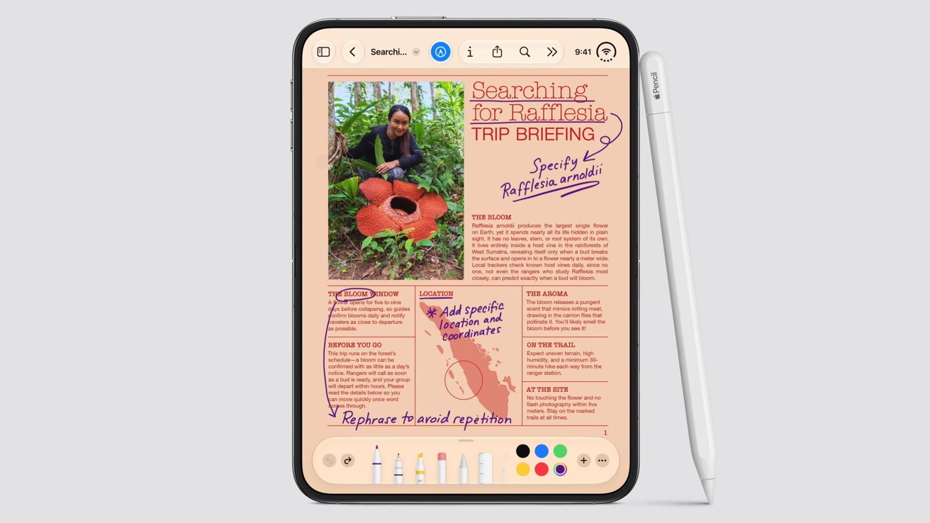 iPhone Duo unfolded showing a document with handwritten Pencil annotations, Apple Pencil (USB-C) resting beside it