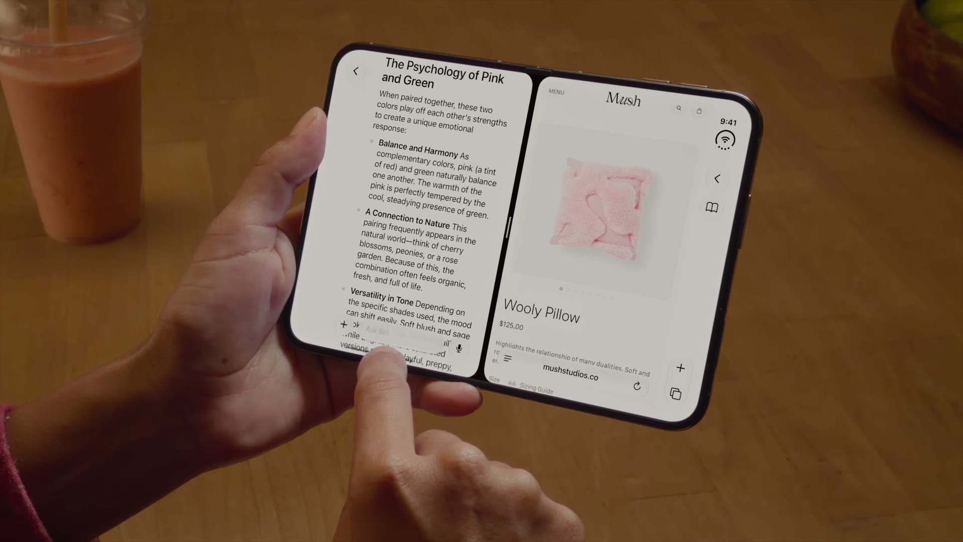 Hands using Split View multitasking on the open iPhone Duo